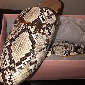Brand new never worn snake print mule slippers.